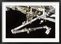 Framed Canadian-Built Space Station Remote Manipulator System (Canadarm2), during Undocking AWctivities
