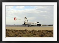 Framed Space Shuttle Discovery Deploys its Drag Chute as the Vehicle comes to a Stop