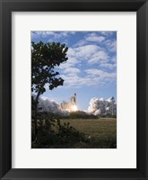 Framed Space Shuttle Atlantis lifts off from its Launch Pad at Kennedy Space Center, Florida
