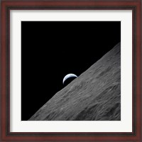 Framed crescent Earth Rises above the Lunar Horizon