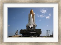 Framed Space Shuttle Discovery makes its way to the launch pad at Kennedy Space Center