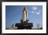 Framed Space Shuttle Discovery makes its way to the launch pad at Kennedy Space Center