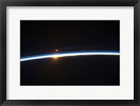 Framed Thin line of Earth's Atmosphere and the Rising Sun