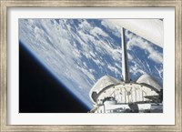 Framed Partial view of Space Shuttle Endeavour Backdropped against Earth