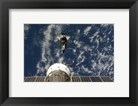 Framed Space Shuttle Endeavour and a Soyuz spacecraft