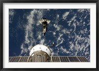 Framed Space Shuttle Endeavour and a Soyuz spacecraft