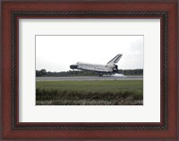 Framed Space Shuttle Discovery Touches Down on the Runway at Kennedy Space Center