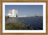 Framed Viewed across the Basin, Space Shuttle Atlantis Crawls Toward the Launch Pad