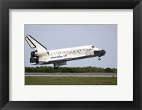 Framed Space Shuttle Discovery Approaches Landing on the Runway at the Kennedy Space Center