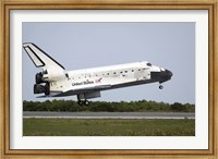 Framed Space Shuttle Discovery Approaches Landing on the Runway at the Kennedy Space Center