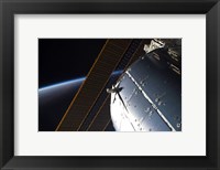 Framed Portion of the International Space Station's Columbus Laboratory and Solar Array Panels