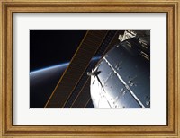 Framed Portion of the International Space Station's Columbus Laboratory and Solar Array Panels