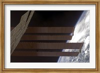 Framed International Space Station's Solar array Panels and Earth's Horizon