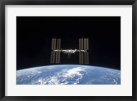 Framed International Space Station Backdropped by Earth's horizon