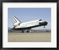 Framed Space Shuttle Endeavour's Main Landing Gear Touches Down on the Runway