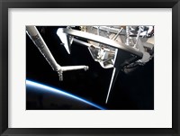 Framed Components of Space Shuttle Discovery Backdropped by Earth's Horizon