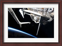 Framed Components of Space Shuttle Discovery Backdropped by Earth's Horizon