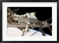 Framed Canadian-Built Dextre Robotic System in the Grasp of the Robotic Canadarm2