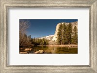 Framed El Capitan towers over Merced River, Yosemite, California