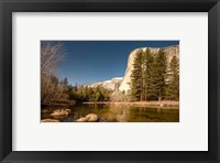 Framed El Capitan towers over Merced River, Yosemite, California