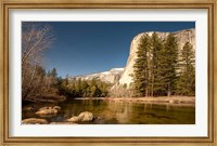 Framed El Capitan towers over Merced River, Yosemite, California