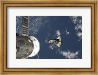 Framed Space Shuttle Endeavour, a Russian Spacecraft is Visible in the Foreground