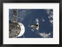 Framed Space Shuttle Endeavour, a Russian Spacecraft is Visible in the Foreground