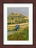 Framed Blue tractor on rural road, San Vicente de la Sonsierra Village, La Rioja, Spain