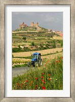 Framed Blue tractor on rural road, San Vicente de la Sonsierra Village, La Rioja, Spain