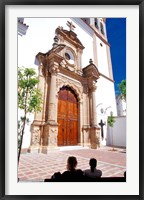 Framed Silhouette of Women Talking in Front of Cathedral, Marbella, Spain