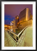 Framed Guggenheim Museum lit at night, Bilbao, Spain