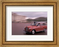Framed Cab racing past Buckingham Palace, London, England