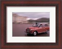 Framed Cab racing past Buckingham Palace, London, England