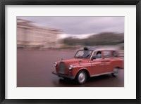 Framed Cab racing past Buckingham Palace, London, England