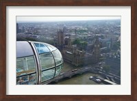 Framed London Eye as it passes Parliament and Big Ben, Thames River, London, England