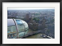 Framed London Eye as it passes Parliament and Big Ben, Thames River, London, England