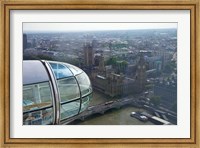 Framed London Eye as it passes Parliament and Big Ben, Thames River, London, England