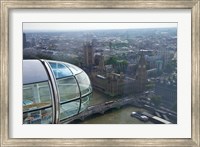 Framed London Eye as it passes Parliament and Big Ben, Thames River, London, England