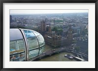 Framed London Eye as it passes Parliament and Big Ben, Thames River, London, England