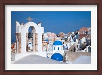 Framed Bell tower and blue domes of church in village of Oia, Santorini, Greece