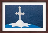 Framed Church with blue dome and white cross in village of Firostefani, Santorini, Greece