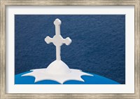 Framed Church with blue dome and white cross in village of Firostefani, Santorini, Greece