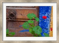 Framed Geraniums and old door in Chania, Crete, Greece