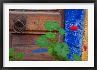 Framed Geraniums and old door in Chania, Crete, Greece