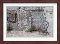 Framed Old Building chair and doorway in town of Oia, Santorini, Greece