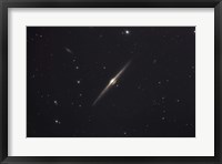 Framed NGC 4565, an edge-on unbarred spiral galaxy in the Constellation Coma Berenices