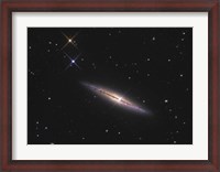 Framed NGC 4013 is an edge-on unbarred spiral galaxy in the Constellation Ursa Major