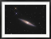 Framed NGC 4013 is an edge-on unbarred spiral galaxy in the Constellation Ursa Major