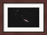 Framed NGC 4013 is an edge-on unbarred spiral galaxy in the Constellation Ursa Major