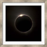 Framed Solar Eclipse with prominences and diamond ring effect